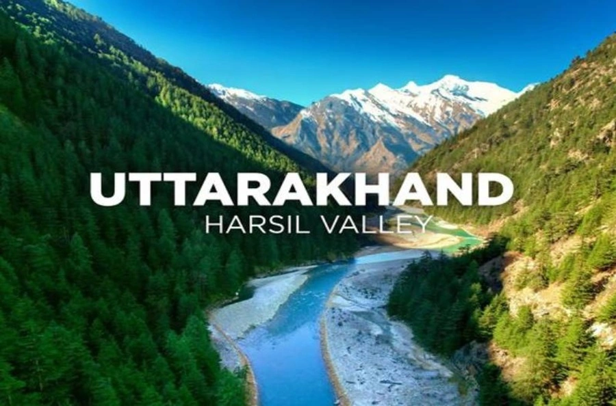 Scenic Harsil Valley with turquoise river and snow peaks; image includes the words Uttarakhand and Harsil Valley