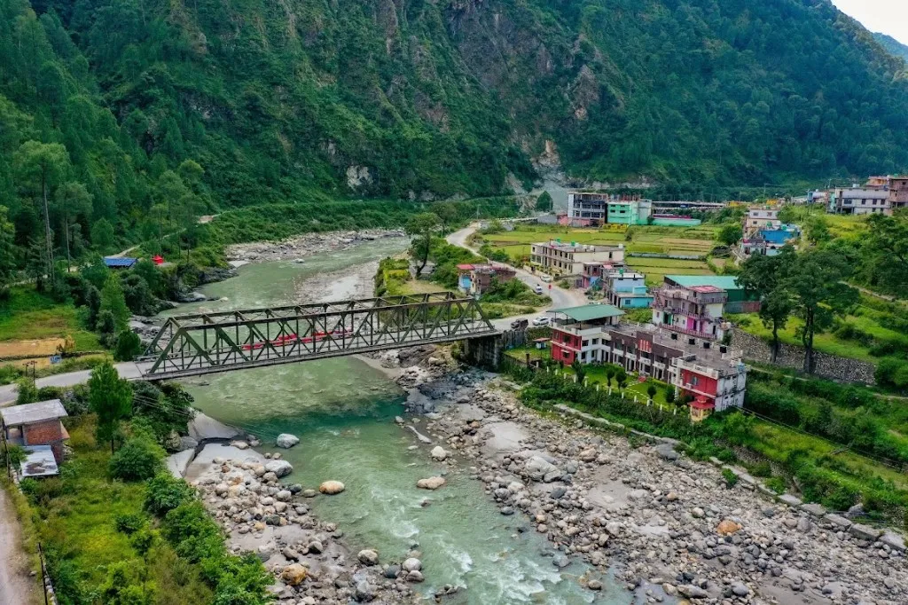 Aerial view of Shiv Parivar Resort, the bridge and turquoise Bhagirathi river