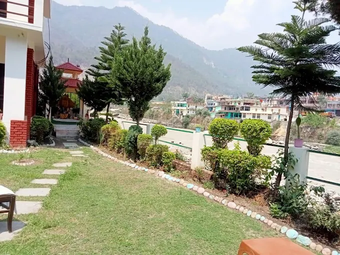Resort garden and lawn with path toward the valley