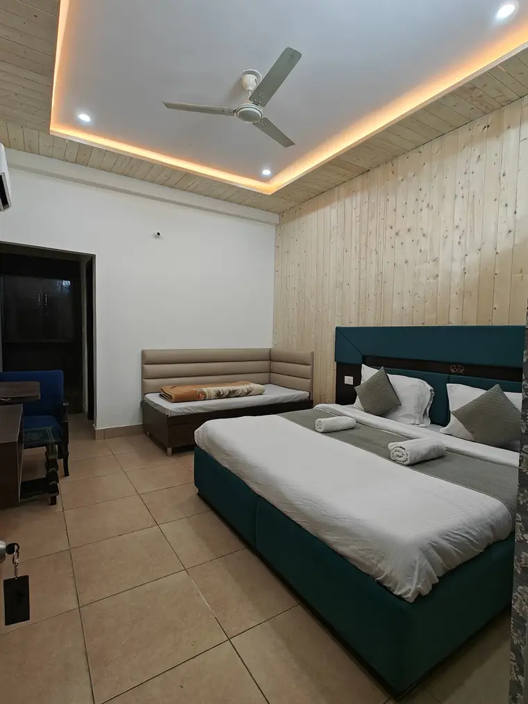 Comfortable family room with extra seating at Shiv Parivar Resort